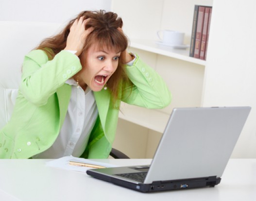 The enraged woman reads news in the Internet The enraged woman reads news in the Internet